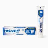 DG Cavity Defense Toothpaste 75g with tube and box on a white background.